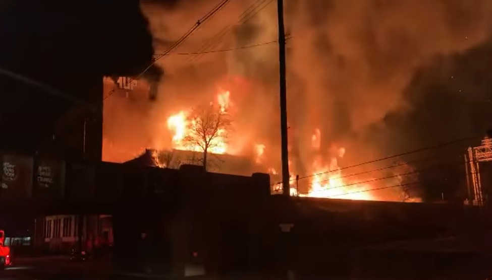 Louisville firefighters battled a 2-alarm fire in multiple large vacant commercial buildings Monday morning.