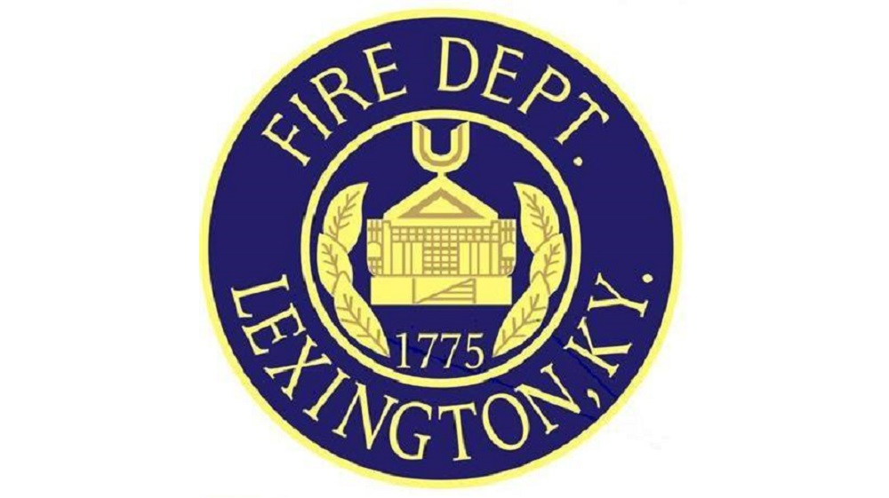A Lexington man has been charged with multiple crimes after waking up behind the wheel and driving off with a firefighter in his vehicle.