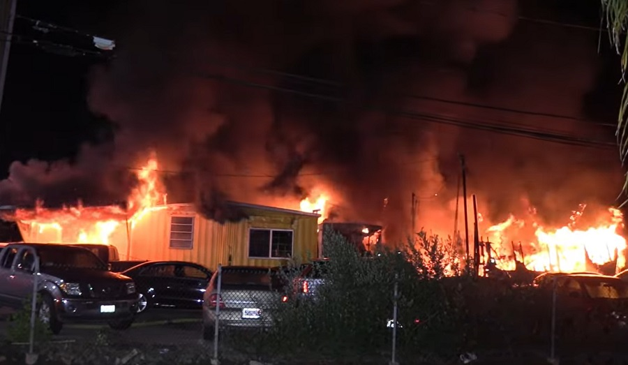 A 2-alarm fire caused heavy damaged to multiple structures in Santa Ana.