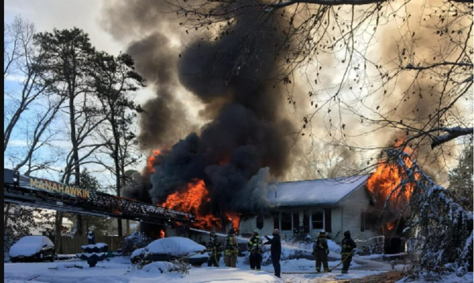 Firefighters battle heavy fire conditions in a Stafford Township dwelling fire.
