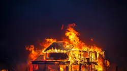A home burns after a fast-moving wildfire swept through the area in the Centennial Heights neighborhood of Louisville, Colorado on Thursday, Dec. 30, 2021.