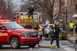 Philadelphia firefighters gather up equipment at the rowhome fire that claimed 13 lives on Jan. 5. Philadelphia firefighters gather up equipment at the rowhome fire that claimed 13 lives on Jan. 5.