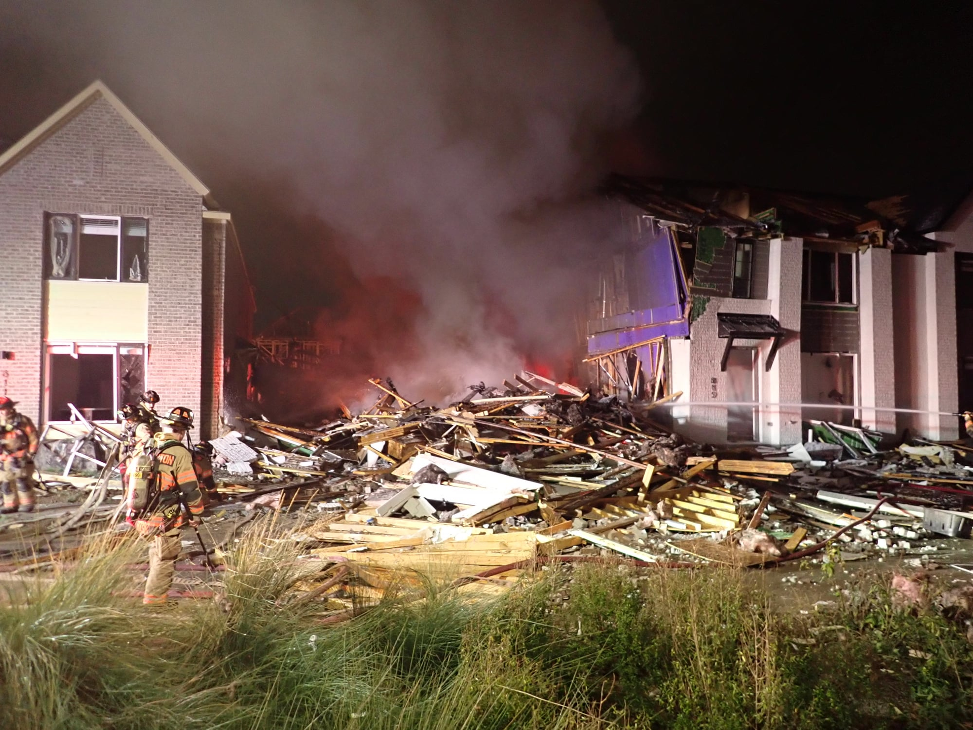 Fire officials believe a gas appliance led to an explosion that destroyed one home and damaged others.