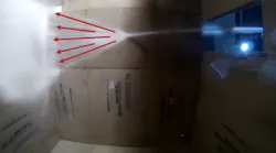 Figure 1. Straight stream, shallow angle off of ceiling. The arrows indicate the direction of bulk water flow.