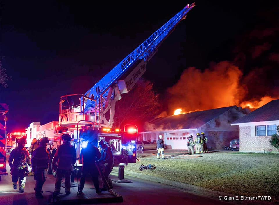 Fort Worth firefighters battle a two-alarm fire in a residential home.