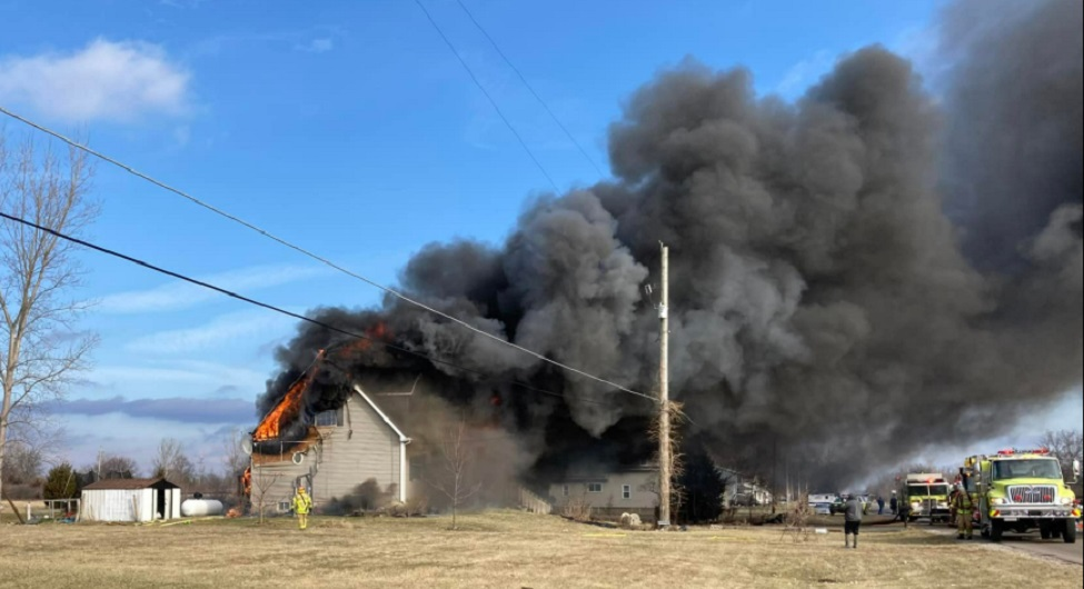 Heavy winds fanned the flames that destroyed a Monroe Township house requiring three-alarms to extinguish.