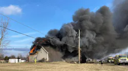 Heavy winds fanned the flames that destroyed a Monroe Township house requiring three-alarms to extinguish.