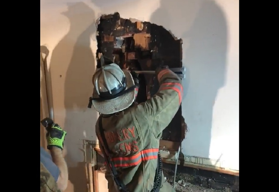 Montgomery County firefighters work to free a man who got stuck in a chimney.