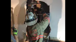 Montgomery County firefighters work to free a man who got stuck in a chimney.