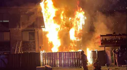 Montgomery County firefighters prepare to attack heavy fire at on overnight townhouse fire.