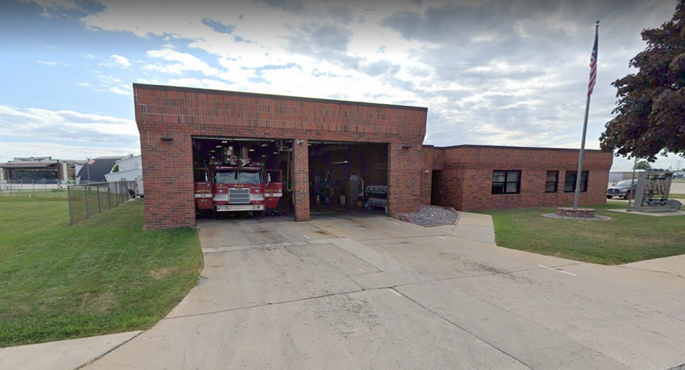 Two Milwaukee firefighters shoveling snow off their station ramp were struck by a vehicle and injured.