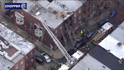 Firefighters work at the scene of a deadly rowhome fire in Philadelphia Wednesday morning. Firefighters work at the scene of a deadly rowhome fire in Philadelphia Wednesday morning.
