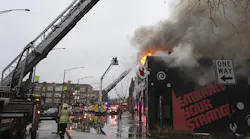 Chicago Fire Department personnel work the scene of a multi-alarm fire in the 4300 block of North Richmond Street in Chicago's Albany Park neighborhood on Feb. 21, 2022.