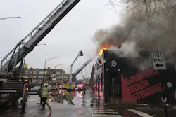 Chicago Fire Department personnel work the scene of a multi-alarm fire in the 4300 block of North Richmond Street in Chicago's Albany Park neighborhood on Feb. 21, 2022.