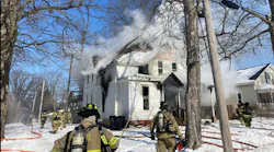 Multiple departments work to control a fast spreading fire in a Bloomington home Monday.