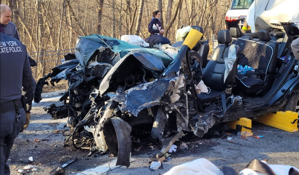 A driver and two children needed to be extricated from their vehicle after striking a tree on the Taconic State Parkway.