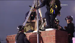 San Diego firefighters rescued a woman trapped upside down in a chimney. San Diego firefighters rescued a woman trapped upside down in a chimney.