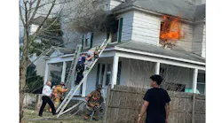 Salisbury firefighters rescued a woman from the roof of her home on fire.