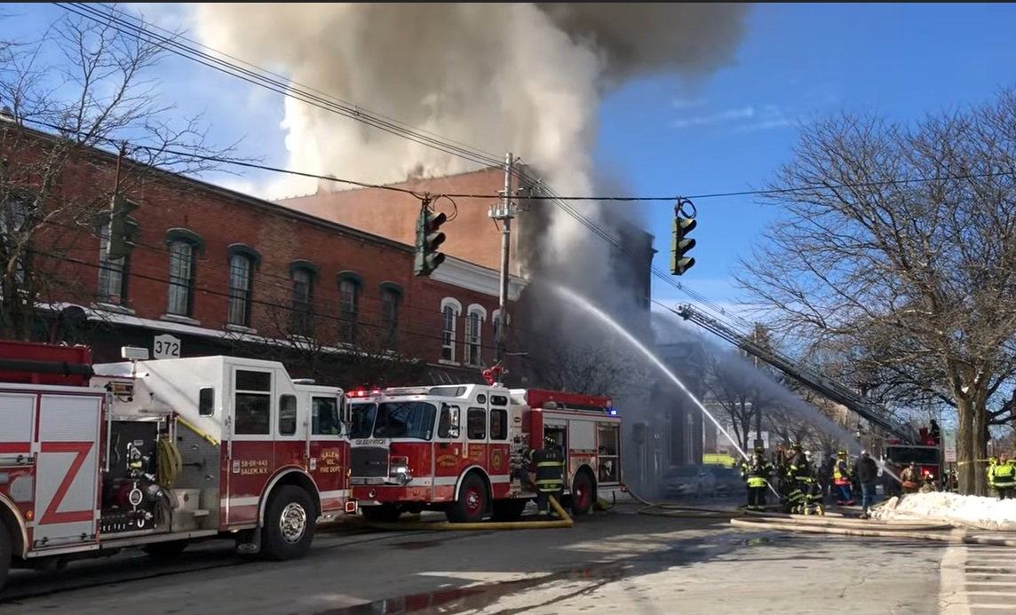 Multiple departments worked to control a three-alarm fire in historic Greenwich Sunday.