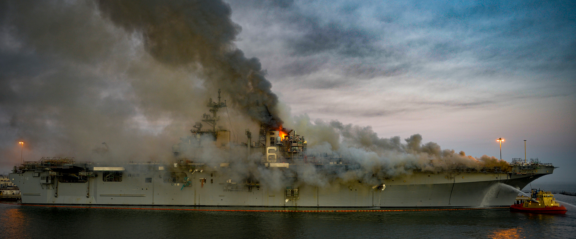 Fire sweeps the Bonhomme Richard as it was moored pier side at Naval Base San Diego.