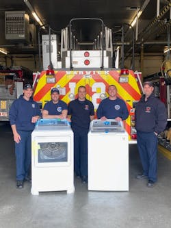 Laundering at the firehouse—beyond cleaning turnout gear in extractors—deserves attention. Even at stations that employ Hot, Warm and Cold Zone design, contaminants (carcinogens, chemicals, bacteria, bedbugs, etc.) can infiltrate living areas. Conventional clothes washers and dryers, including those that have high-temperature operation, can help to mitigate such problems. Here, the Warwick, RI, Fire Department takes delivery of a GE washer and dryer that GE Appliances donated to the department via its GEA4Heroes program. Laundering at the firehouse—beyond cleaning turnout gear in extractors—deserves attention. Even at stations that employ Hot, Warm and Cold Zone design, contaminants (carcinogens, chemicals, bacteria, bedbugs, etc.) can infiltrate living areas. Conventional clothes washers and dryers, including those that have high-temperature operation, can help to mitigate such problems. Here, the Warwick, RI, Fire Department takes delivery of a GE washer and dryer that GE Appliances donated to the department via its GEA4Heroes program.