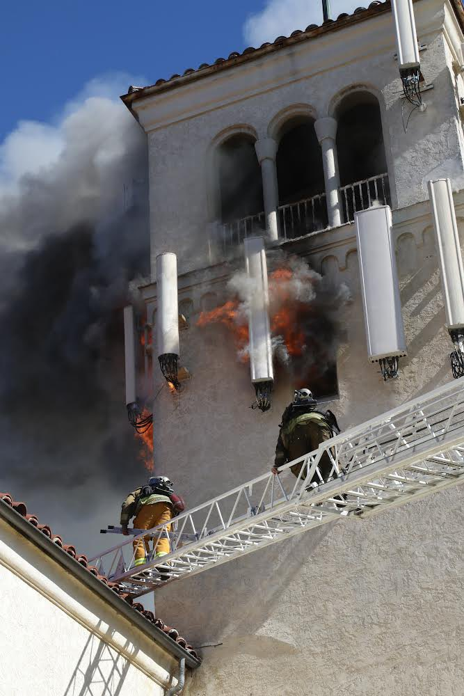 Los Angeles firefighters tackle in the nearly 100-year-old St. John&rsquo;s United Methodist Church in the Watts neighborhood.