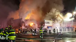 The driver of a tanker carrying approximately 10,000 gallons of gasoline was injured after his vehicle overturned sparking a major fire in multiple Rockville Centre businesses.