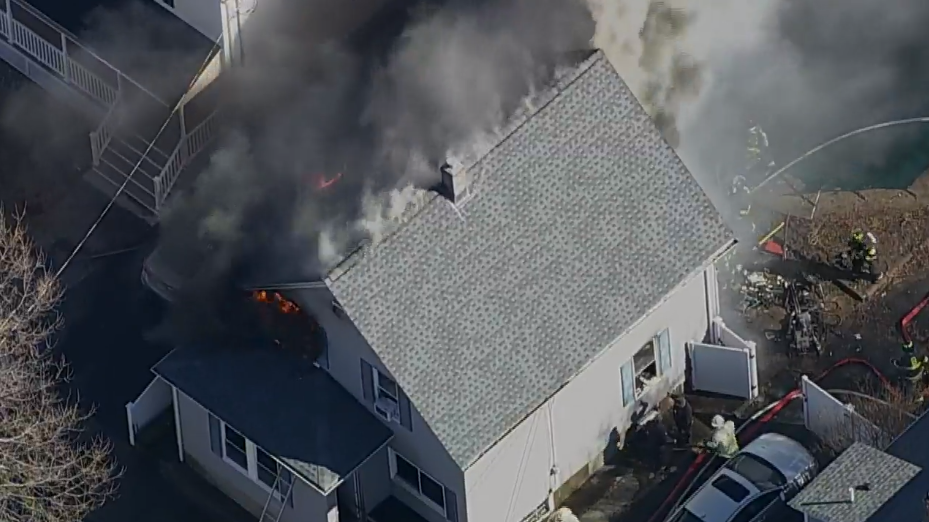 Firefighters from several fire departments battled a challenging fire in a Beverly home Tuesday.