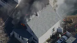 Firefighters from several fire departments battled a challenging fire in a Beverly home Tuesday.