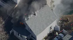 Firefighters from several fire departments battled a challenging fire in a Beverly home Tuesday.