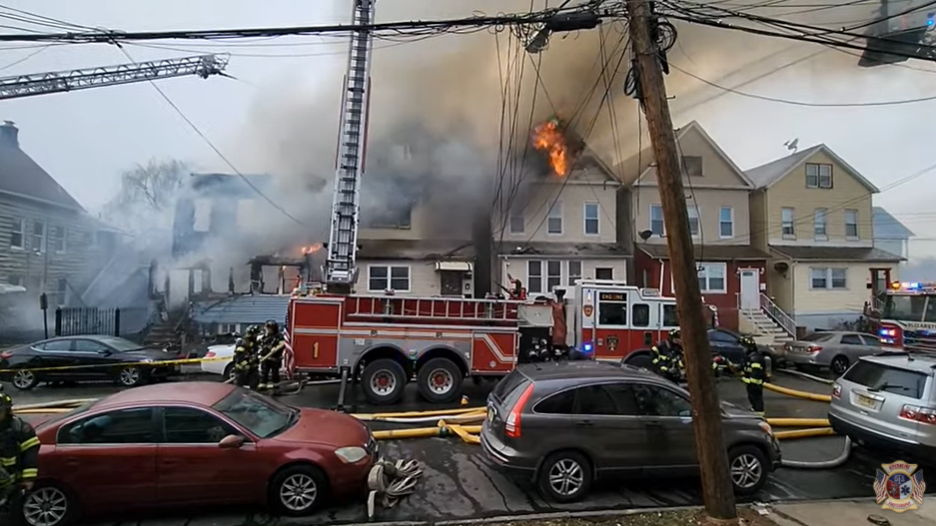 A five-alarm fire ripped through four homes in Elizabeth Sunday.