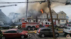 A five-alarm fire ripped through four homes in Elizabeth Sunday.