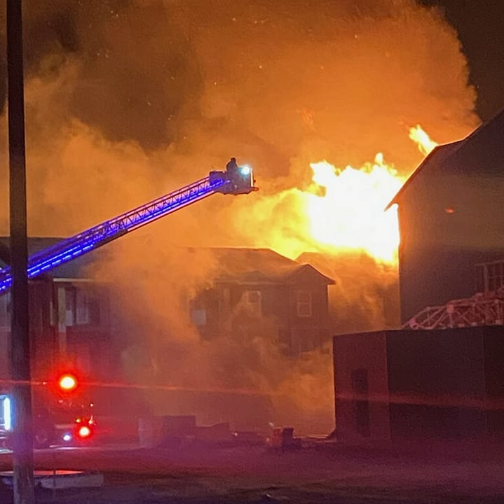 Several fire departments responded to a fire that engulfed an apartment complex under construction in Mills Friday night.