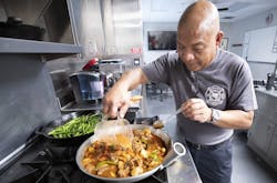 Seminole County firefighter/paramedic Jose Neluna prepares caldereta, a traditional Filipino dish. Seminole County firefighter/paramedic Jose Neluna prepares caldereta, a traditional Filipino dish.