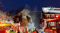 Firefighters work to extinguish a house fire on Fenway Drive on Saturday, March 26, 2022.