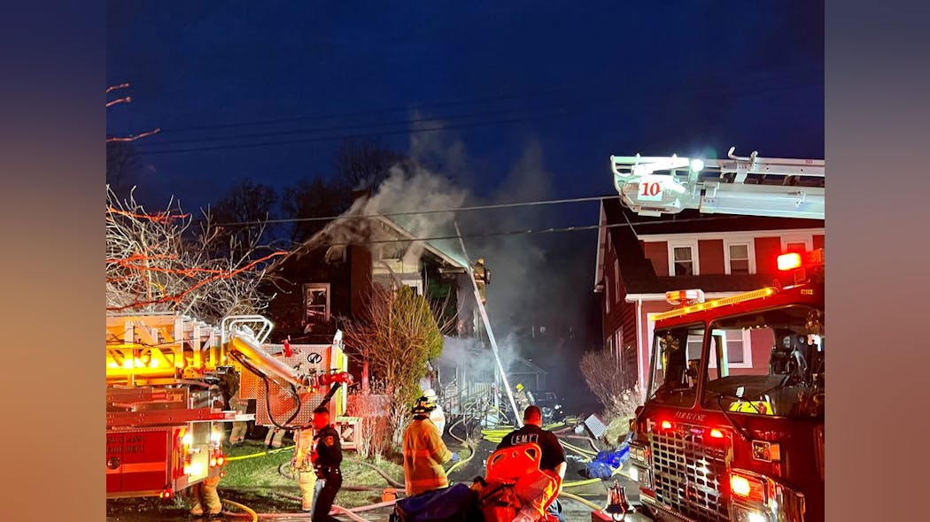 Firefighters work to extinguish a house fire on Fenway Drive on Saturday, March 26, 2022.