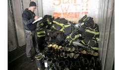 Clifton firefighter Oleg Skachko logs donated equipment in the back of a trailer on Wed. March 9, 2022. The Clifton Fire Department is collecting turnout gear from area departments to send to Ukraine.