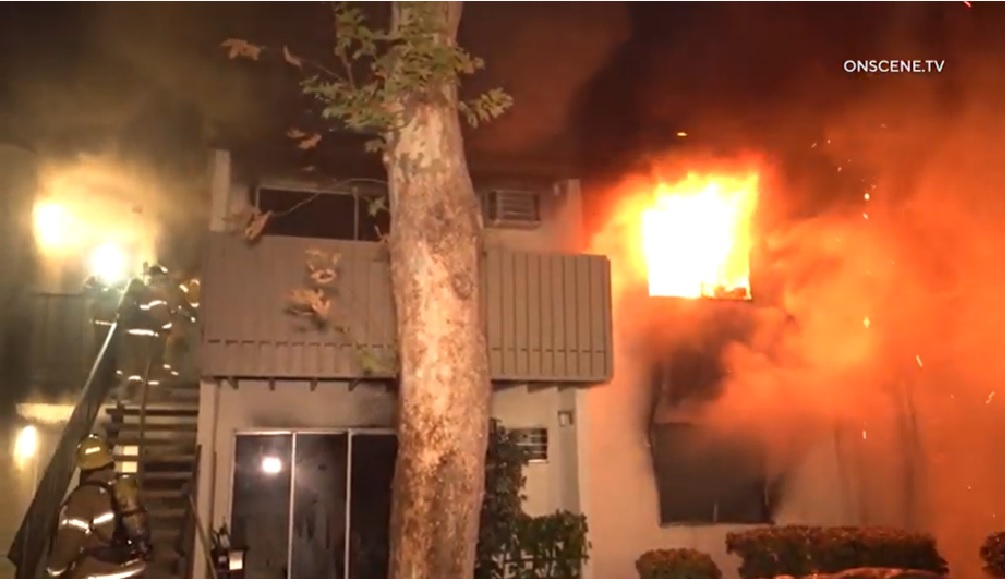 Anaheim firefighters battled a two-alarm second story apartment fire that injured one civilian.