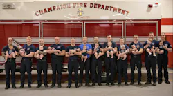 Champaign firefighters posed with a dozen new babies born in the last 12 months to fire department members.