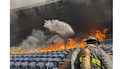 Denver firefighters battle a fire at Mile High Stadium that damaged seating and suites.