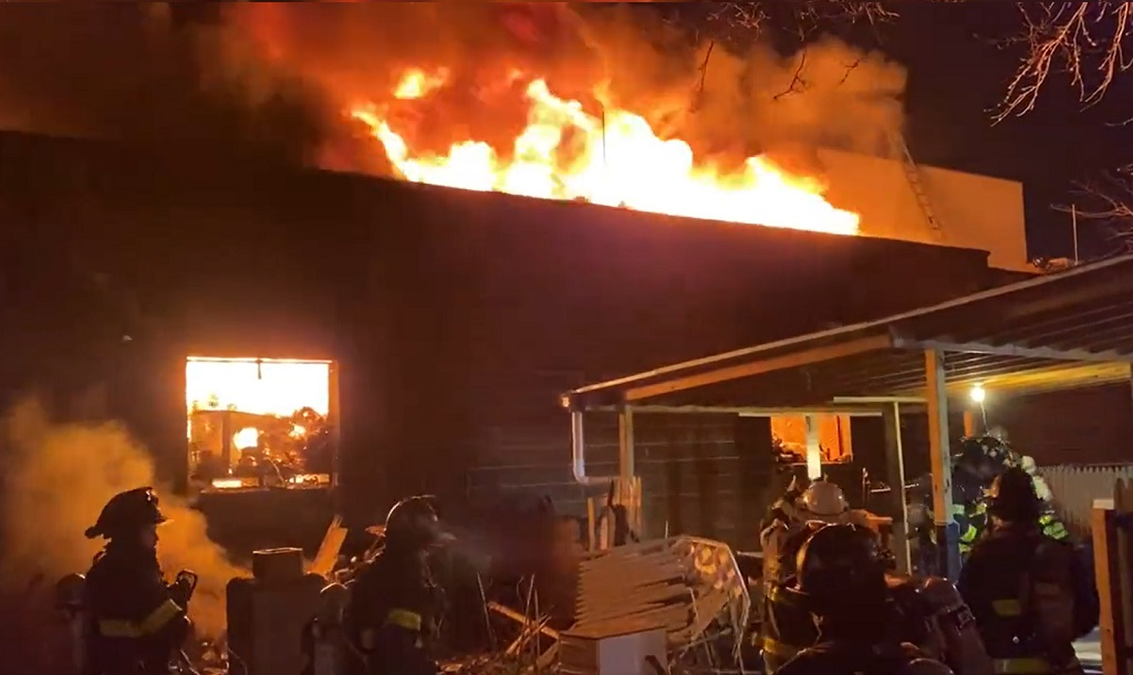 FDNY firefighters battled a five-alarm fire in a plumbing and electrical supply store in Jamaica, Queens.