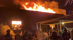 FDNY firefighters battled a five-alarm fire in a plumbing and electrical supply store in Jamaica, Queens.