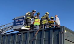 A dumpster truck driver positioned his vehicle allowing a fire victim to jump to safety from a second-floor window at a Willimantic structure fire. A dumpster truck driver positioned his vehicle allowing a fire victim to jump to safety from a second-floor window at a Willimantic structure fire.