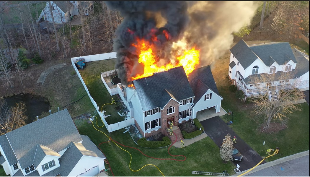 Chesterfield firefighters battled heavy fire conditions in the attic of a large multi-story home early Sunday morning that left five people homeless.