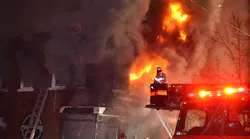 Fire spread upward rapidly and into the voids between the floors and the roof of a mixed occupancy, requiring the rescue of a resident from the second floor and a firefighter who lost his bearings amid clutter in an apartment. Fire spread upward rapidly and into the voids between the floors and the roof of a mixed occupancy, requiring the rescue of a resident from the second floor and a firefighter who lost his bearings amid clutter in an apartment.