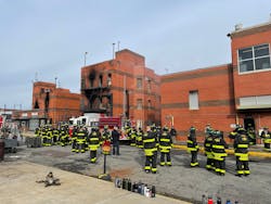Probationary FDNY firefighters learn about teamwork on their first day at the fire academy from instructors who conduct training.