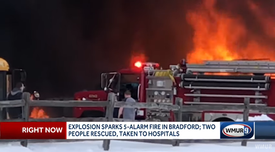 A five-alarm fire ripped through a school bus depot following an explosion in Bradford.