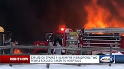 A five-alarm fire ripped through a school bus depot following an explosion in Bradford. A five-alarm fire ripped through a school bus depot following an explosion in Bradford.