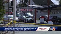 A firefighter and civilian were shot outside a hot dog restaurant in Winston-Salem Friday.