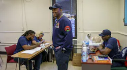 Chicago Fire Department Lt. Quention Curtis with students at the Black Fire Brigade in the Washington Park neighborhood on April 7, 2022, in Chicago.